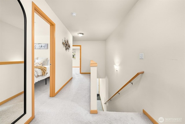 343 Tremont Ave Unit 102, Bellingham, WA 98226 - corridor featuring carpet, baseboards, and an upstairs landing