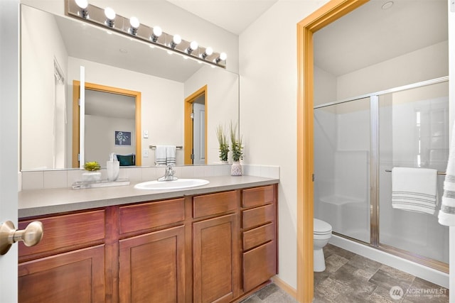 343 Tremont Ave Unit 102, Bellingham, WA 98226 - bathroom featuring a stall shower, vanity, and toilet