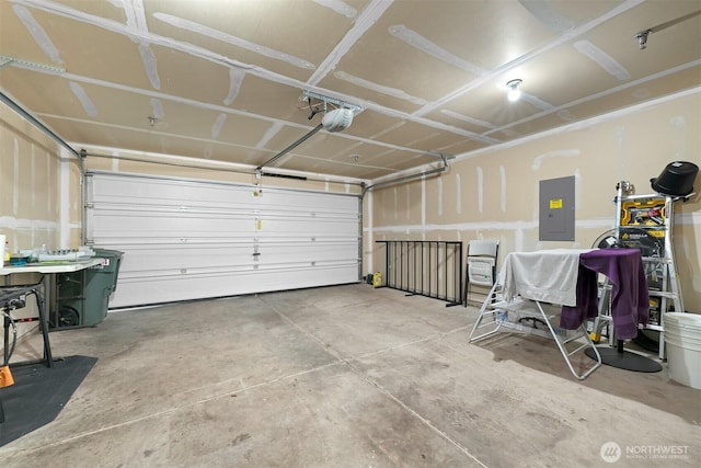 343 Tremont Ave Unit 102, Bellingham, WA 98226 - garage featuring electric panel and a garage door opener