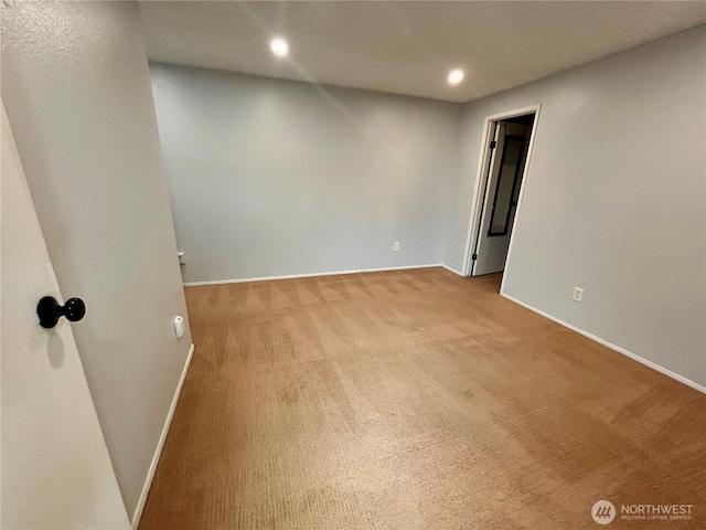 spare room with baseboards, carpet, and recessed lighting