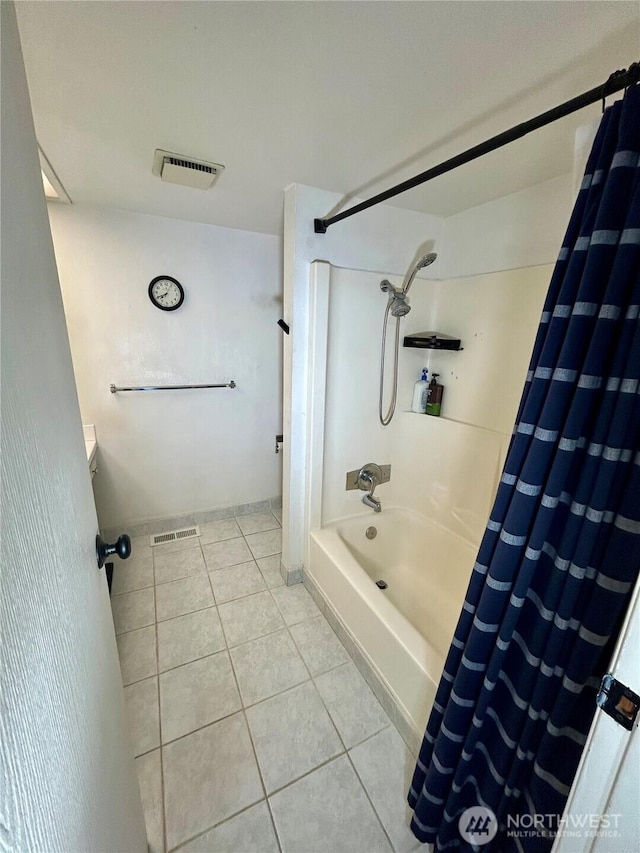 full bathroom with tile patterned flooring and shower / tub combo