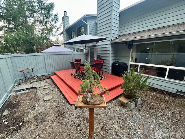 wooden deck featuring fence and outdoor dining area