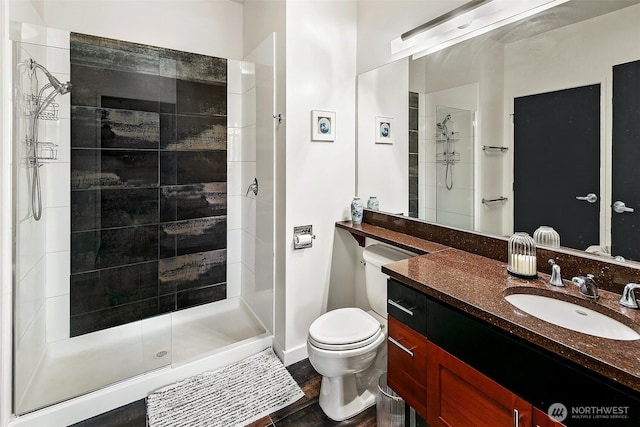 125 E Lynn St Unit 205, Seattle, WA 98102 - full bath with a stall shower, toilet, vanity, and wood finished floors