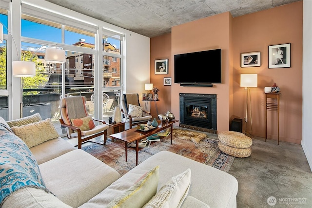 125 E Lynn St Unit 205, Seattle, WA 98102 - living area with healthy amount of natural light and a glass covered fireplace
