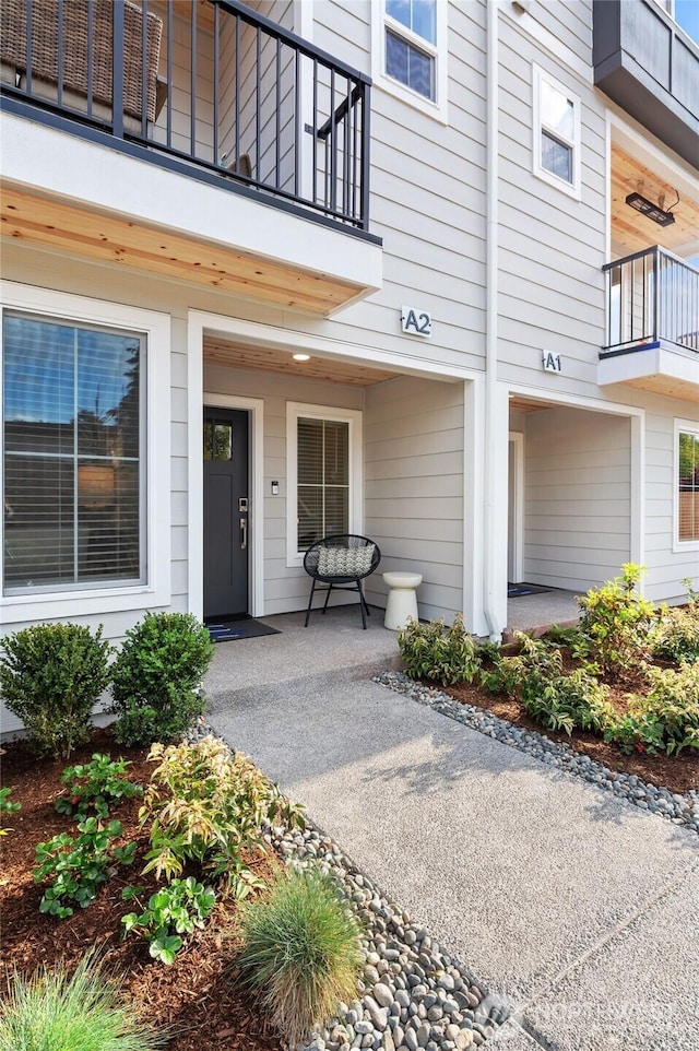 doorway to property featuring a balcony