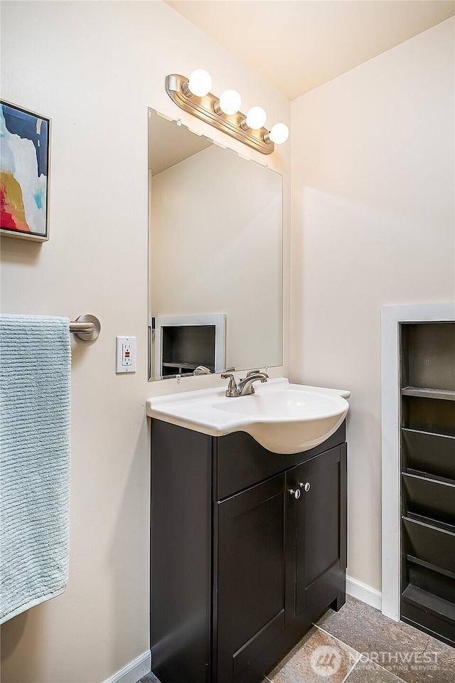 bathroom featuring vanity and baseboards