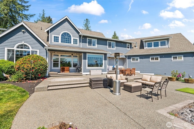 14028 104th Street Ct E, Puyallup, WA 98374 - back of house featuring outdoor lounge area, roof with shingles, and a patio