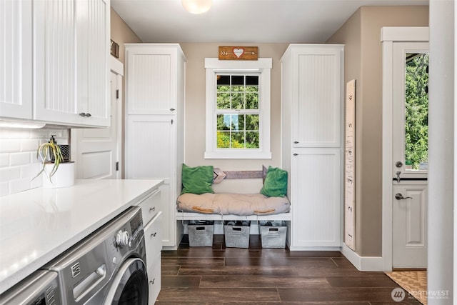 14028 104th Street Ct E, Puyallup, WA 98374 - mudroom featuring independent washer and dryer, dark wood-type flooring, and baseboards