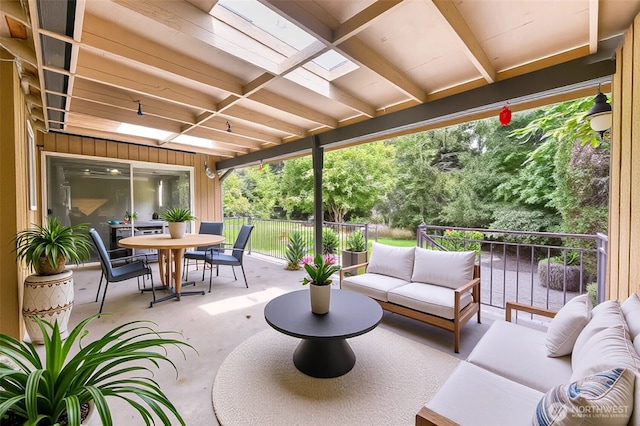 view of patio / terrace with an outdoor living space, fence, and outdoor dining area
