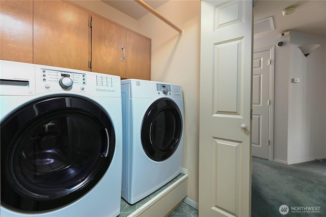 laundry room featuring independent washer and dryer, carpet floors, baseboards, and cabinet space