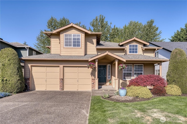 traditional-style home with concrete driveway, a garage, a shingled roof, brick siding, and a front yard