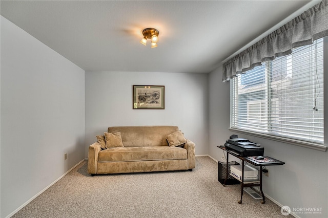 sitting room with light colored carpet and baseboards