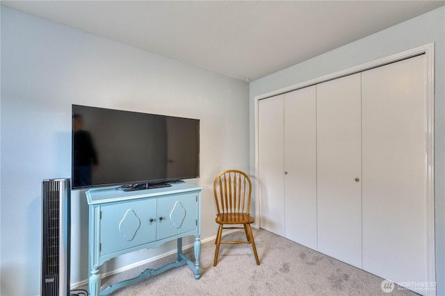 sitting room with carpet floors and baseboards