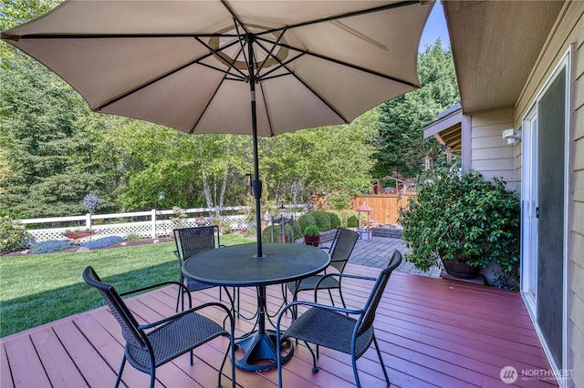 deck featuring outdoor dining area