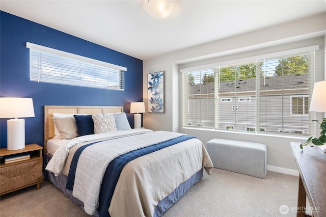 bedroom featuring baseboards and carpet flooring