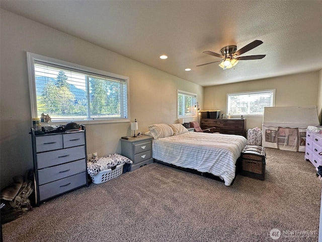 carpeted bedroom featuring a ceiling fan and recessed lighting