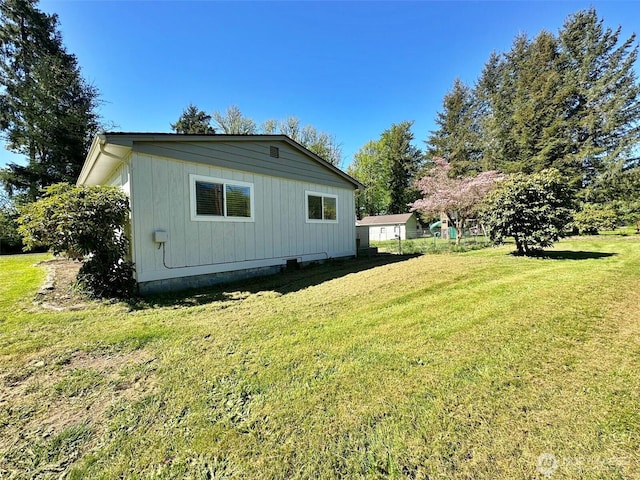 view of property exterior with a lawn