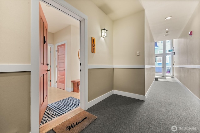 hall with baseboards, recessed lighting, and carpet floors