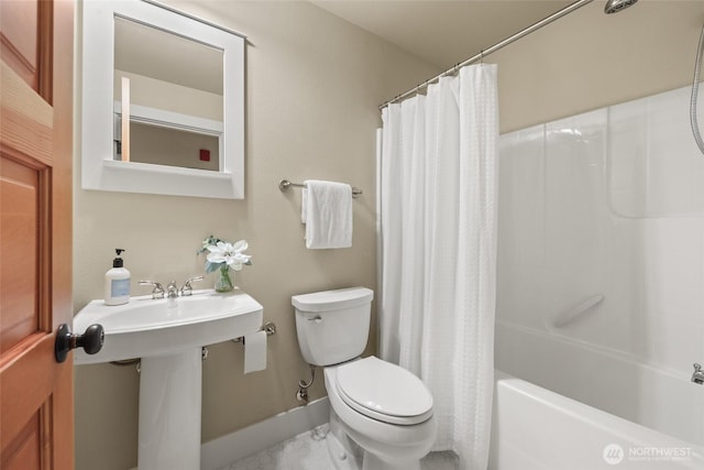 full bath featuring marble look tile flooring, toilet, baseboards, and shower / tub combo with curtain