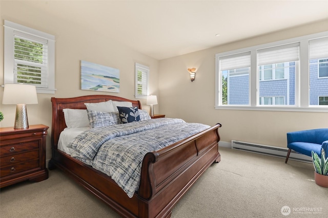 bedroom featuring carpet floors, a baseboard radiator, and baseboards