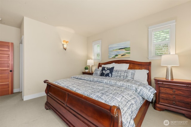bedroom with carpet and baseboards