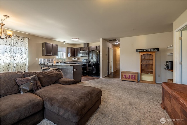557 N Montclair Ave N, East Wenatchee, WA 98802 - living room with dark colored carpet and a chandelier