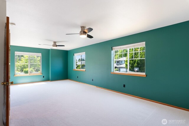 3828 Sutton Pl, Anacortes, WA 98221 - spare room featuring carpet, baseboards, and a ceiling fan