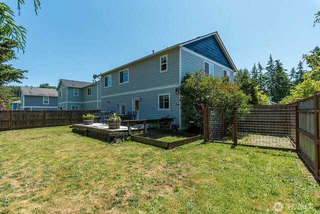 3828 Sutton Pl, Anacortes, WA 98221 - back of property featuring a garden