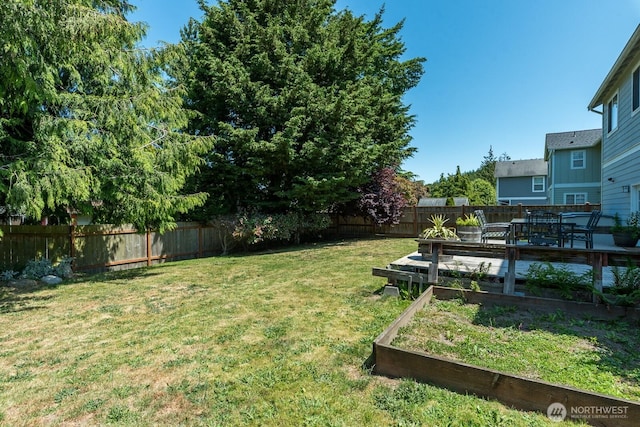 3828 Sutton Pl, Anacortes, WA 98221 - view of yard with a garden and a wooden deck