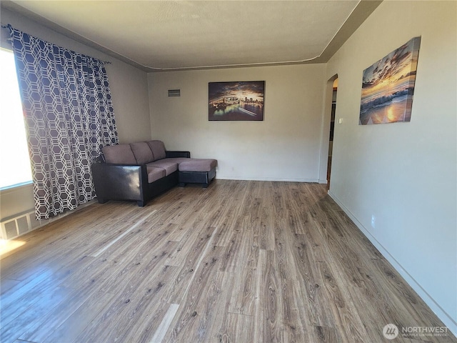 234 SW 15th Ave, Ephrata, WA 98823 - sitting room featuring arched walkways and wood finished floors