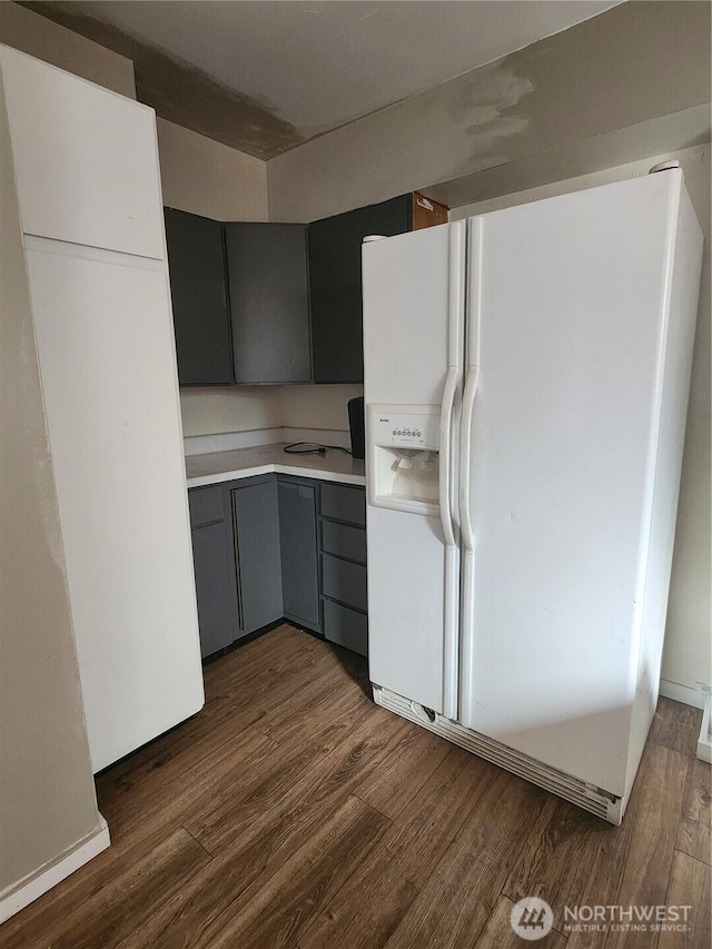 234 SW 15th Ave, Ephrata, WA 98823 - kitchen with white fridge with ice dispenser, gray cabinets, wood finished floors, and light countertops