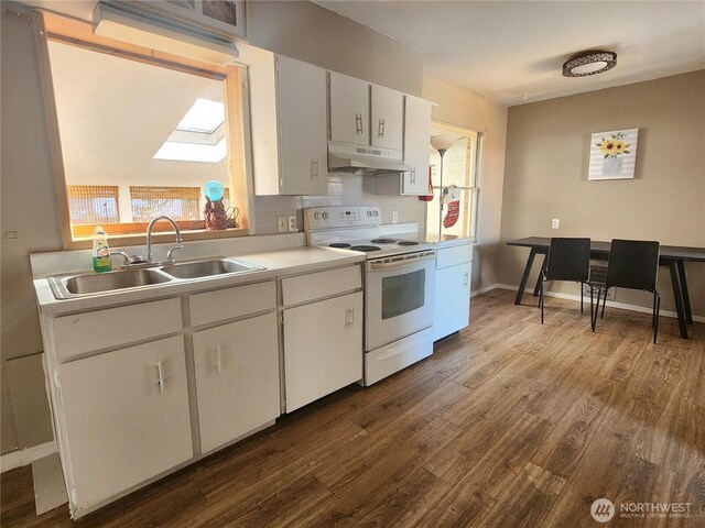 234 SW 15th Ave, Ephrata, WA 98823 - kitchen featuring white range with electric stovetop, a sink, under cabinet range hood, dark wood-type flooring, and white cabinets
