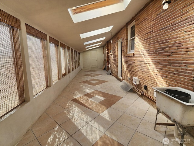234 SW 15th Ave, Ephrata, WA 98823 - corridor featuring light tile patterned flooring and a skylight