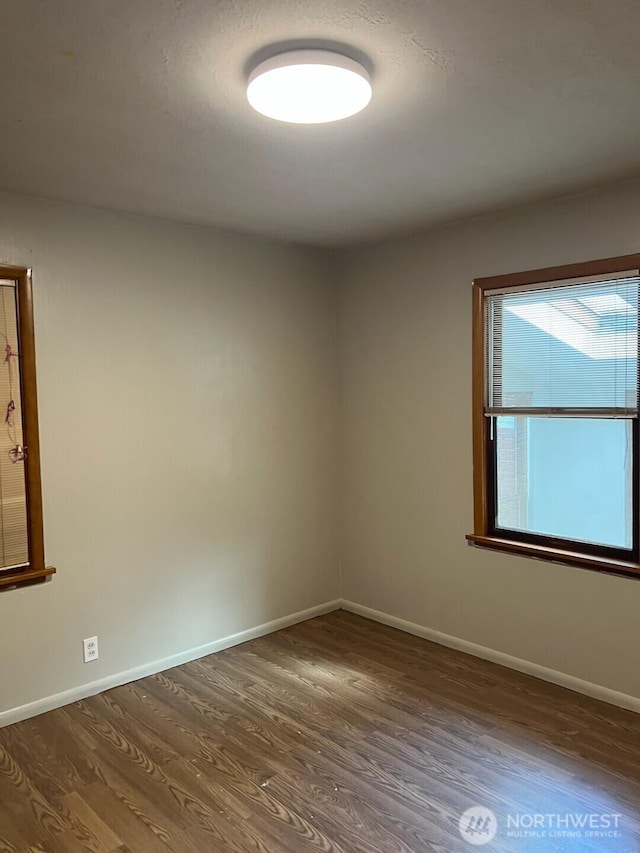 234 SW 15th Ave, Ephrata, WA 98823 - empty room with dark wood-style flooring and baseboards