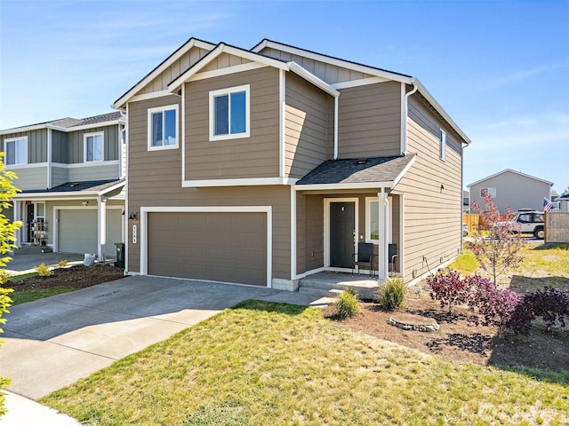 9206 Conine St SE, Yelm, WA 98597 - view of front of house with a garage, board and batten siding, concrete driveway, and a front yard