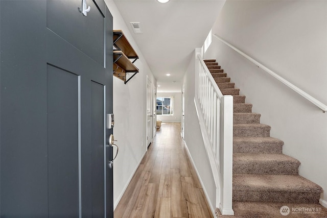 9206 Conine St SE, Yelm, WA 98597 - foyer entrance featuring stairway, light wood-style flooring, recessed lighting, and baseboards