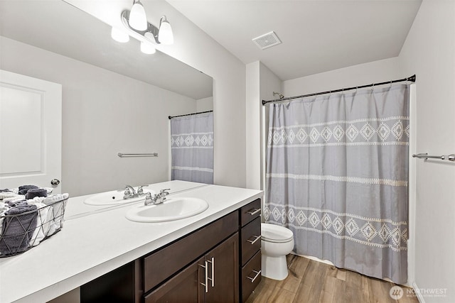9206 Conine St SE, Yelm, WA 98597 - full bath with wood finished floors, toilet, and vanity