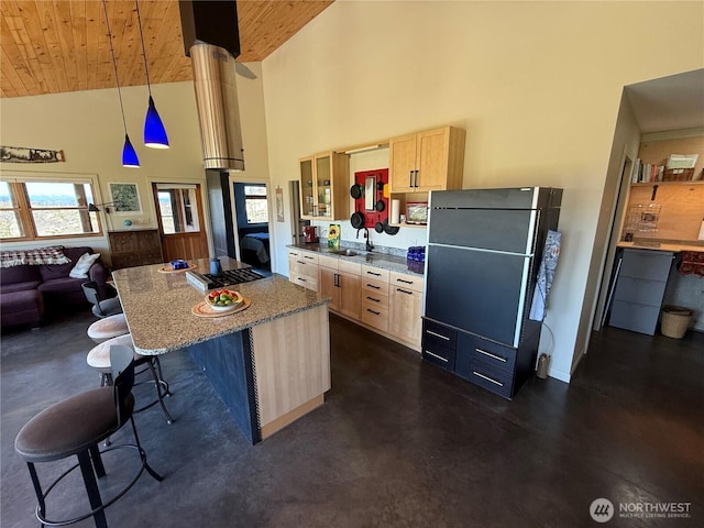 kitchen with a center island, wood ceiling, light brown cabinetry, and high vaulted ceiling