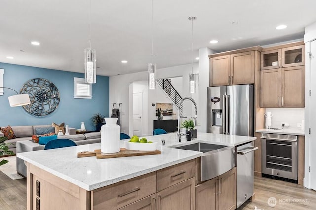 19507 81st Pl NE Unit 3, Kenmore, WA 98028 - kitchen with stainless steel appliances, light wood-style flooring, a sink, wine cooler, and recessed lighting