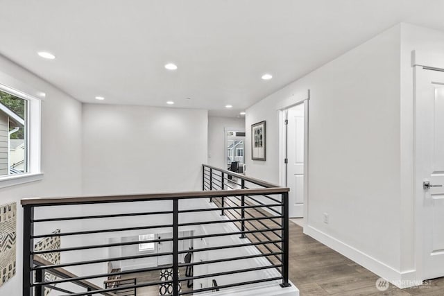 19507 81st Pl NE Unit 3, Kenmore, WA 98028 - hallway with recessed lighting, wood finished floors, an upstairs landing, and baseboards
