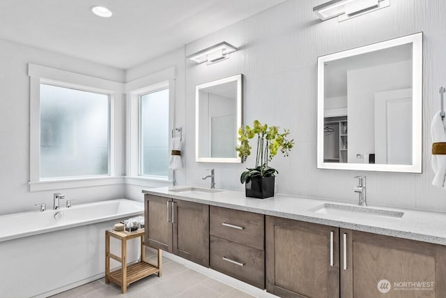 19507 81st Pl NE Unit 3, Kenmore, WA 98028 - full bath with double vanity, a freestanding bath, and tile patterned floors