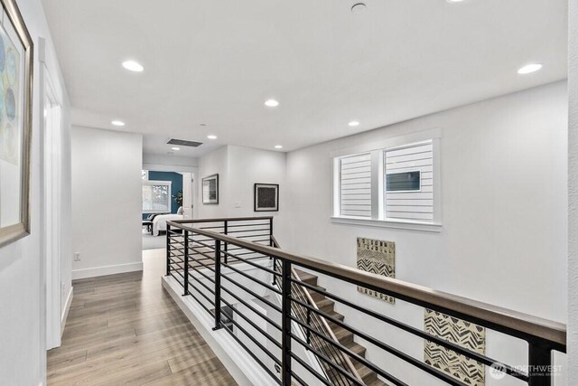 19507 81st Pl NE Unit 3, Kenmore, WA 98028 - hallway featuring an upstairs landing, recessed lighting, wood finished floors, and baseboards