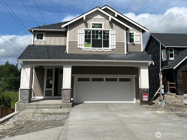 19507 81st Pl NE Unit 3, Kenmore, WA 98028 - craftsman-style house featuring board and batten siding, covered porch, concrete driveway, and an attached garage