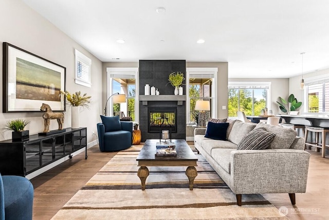 19507 81st Pl NE Unit 3, Kenmore, WA 98028 - living area with wood finished floors, a large fireplace, and recessed lighting