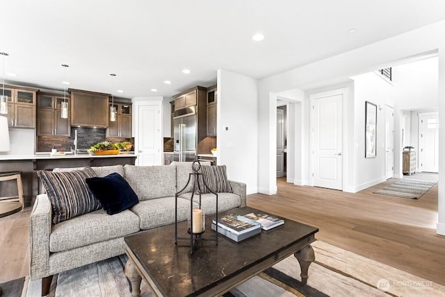 19507 81st Pl NE Unit 3, Kenmore, WA 98028 - living room with light wood-style flooring and recessed lighting