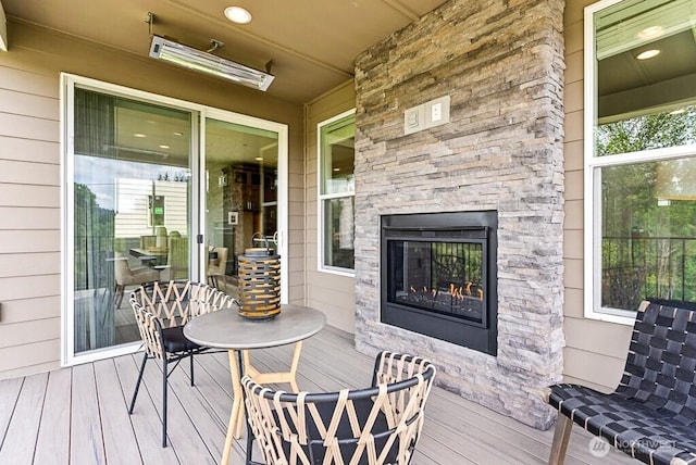19507 81st Pl NE Unit 3, Kenmore, WA 98028 - wooden deck featuring an outdoor stone fireplace