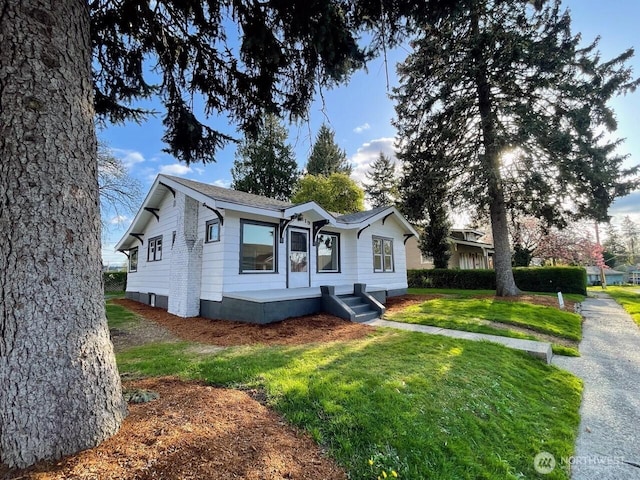 bungalow with a front lawn