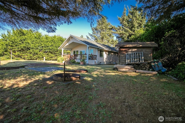 348 Cockle St SW, Ocean Shores, WA 98569 - back of house with a lawn