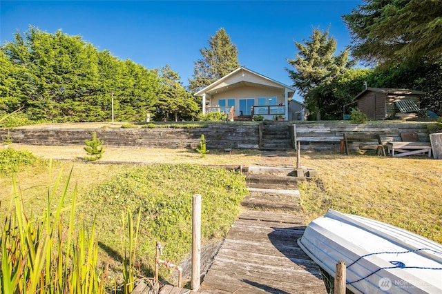 348 Cockle St SW, Ocean Shores, WA 98569 - view of yard featuring an outbuilding, fence, and a storage unit
