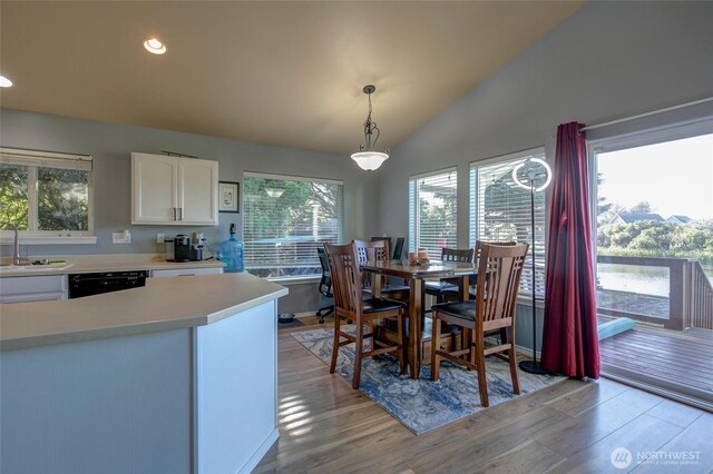 348 Cockle St SW, Ocean Shores, WA 98569 - dining area featuring a wealth of natural light, light wood-style flooring, recessed lighting, and vaulted ceiling